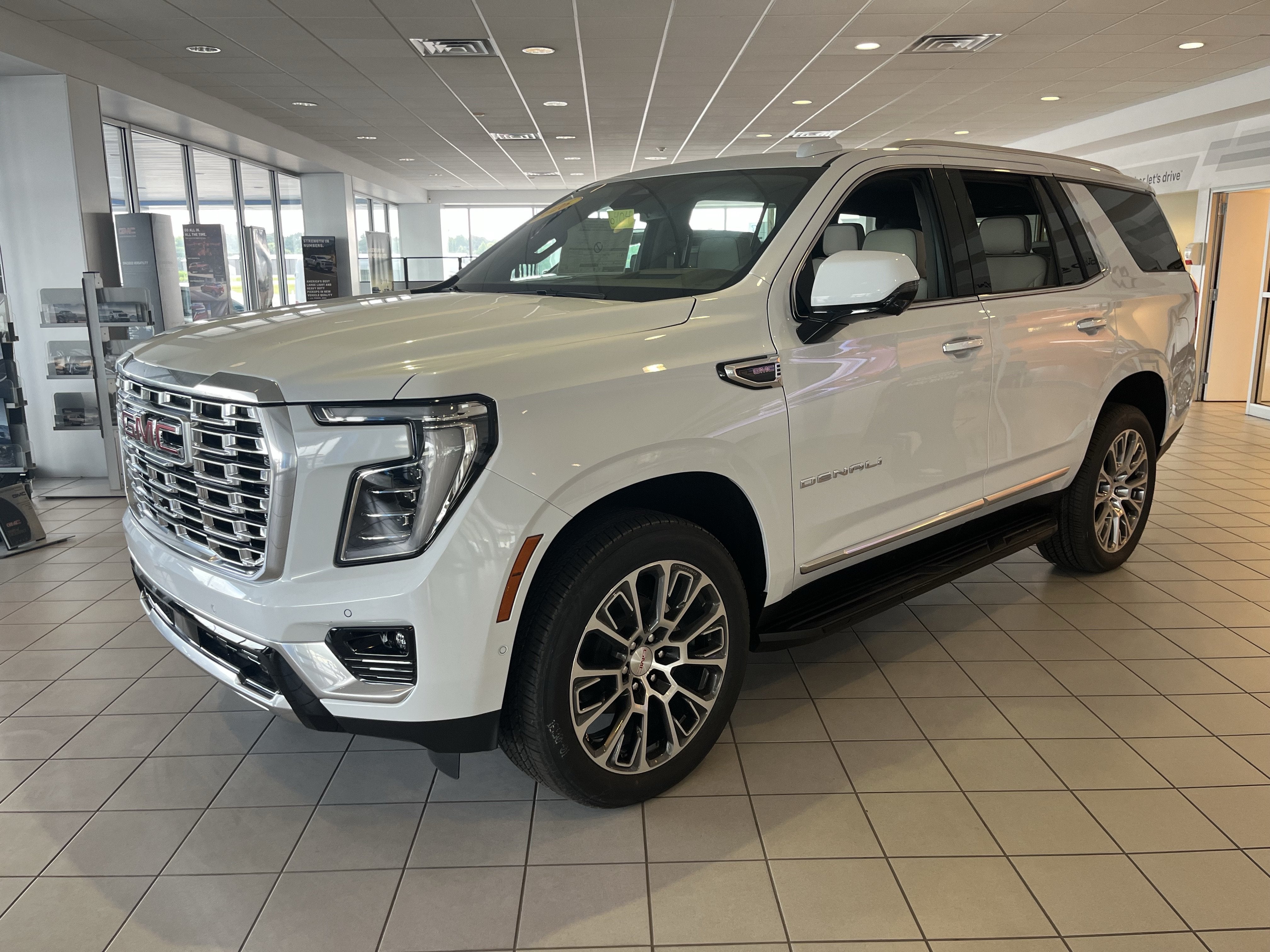 2026 GMC Yukon Denali in Glacier White Tricoat — front three-quarter view