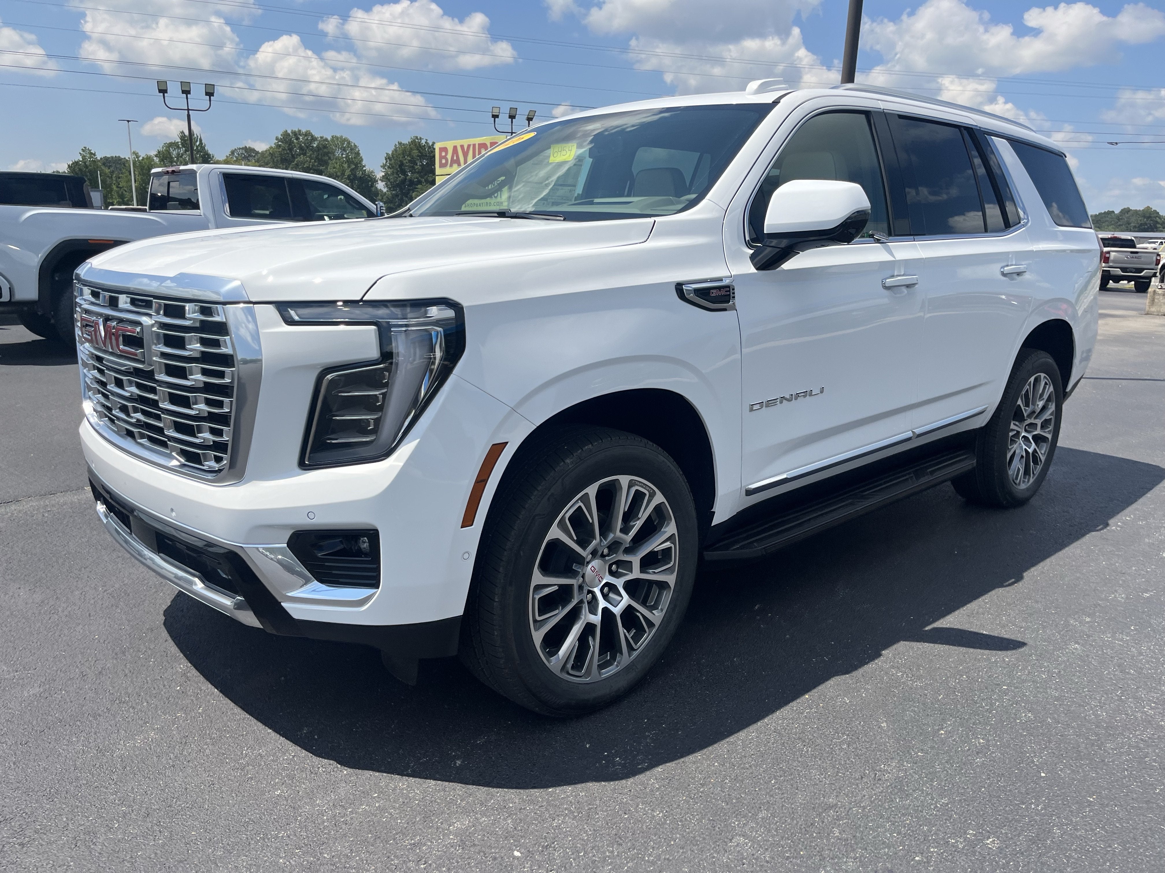 2026 GMC Yukon Denali in Summit White — front three-quarter view