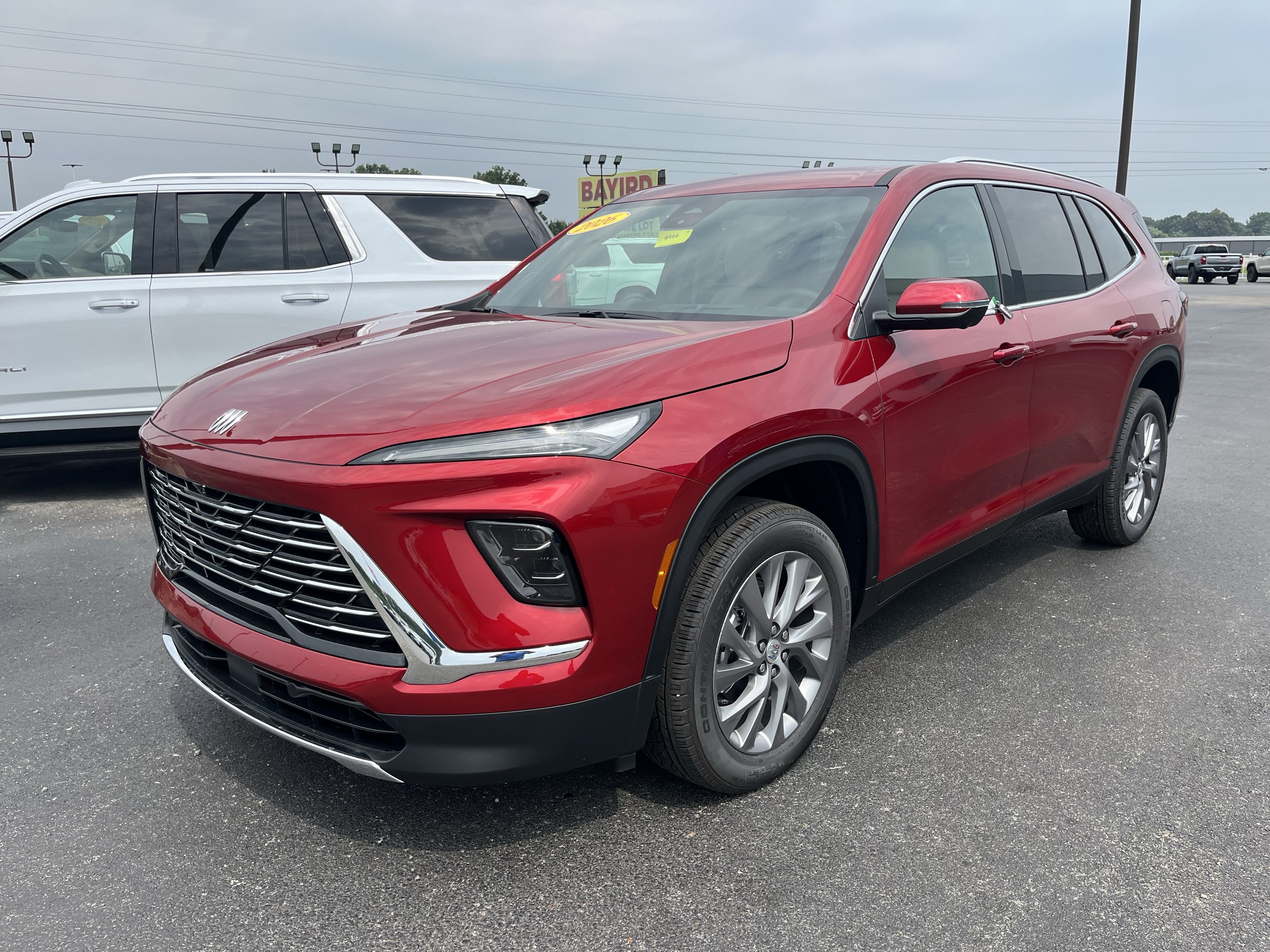 2026 Buick Enclave Preferred in Cherry Red Tintcoat — front three-quarter view