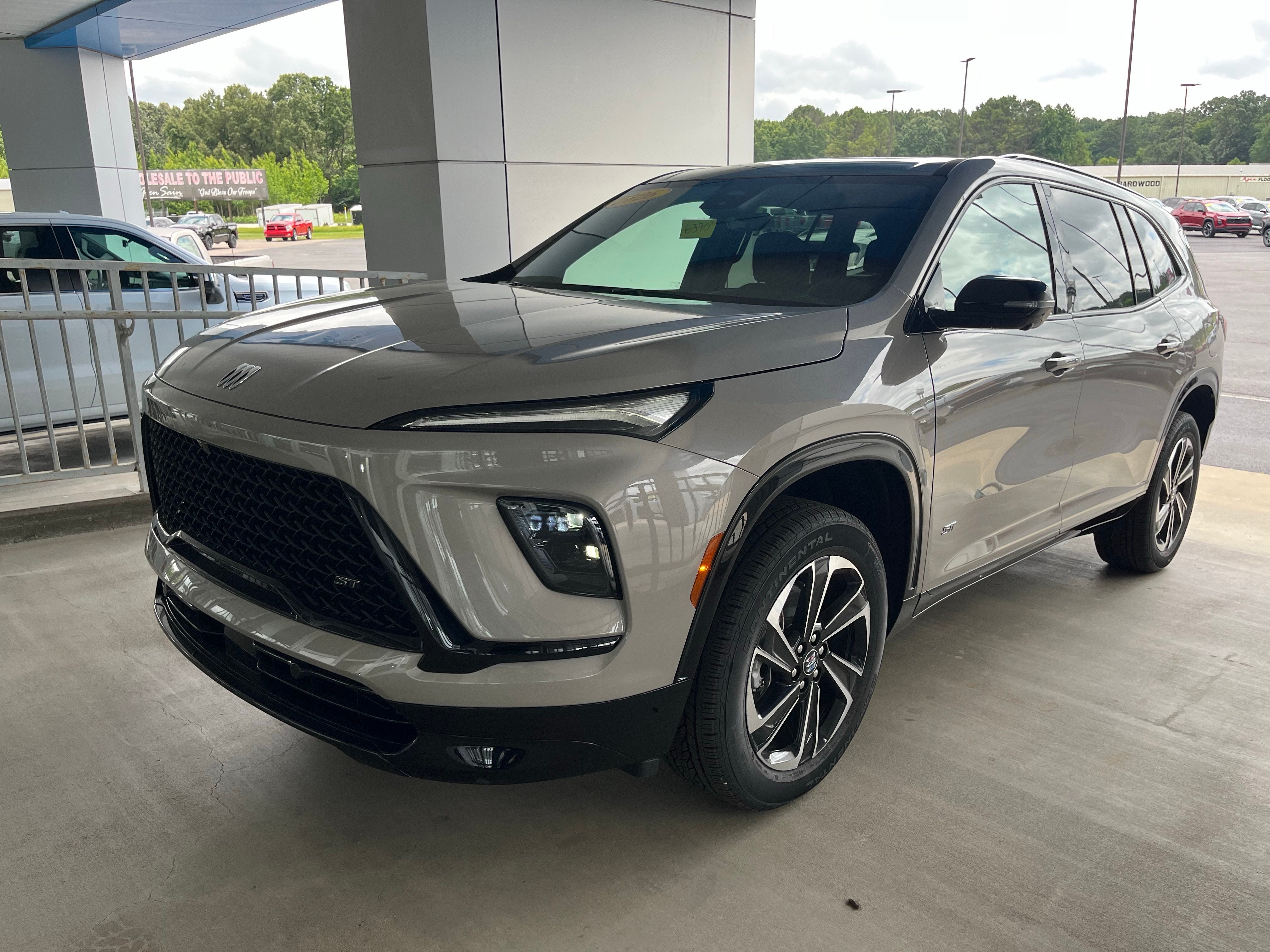 2026 Buick Enclave Sport Touring in Stone Metallic — front three-quarter view