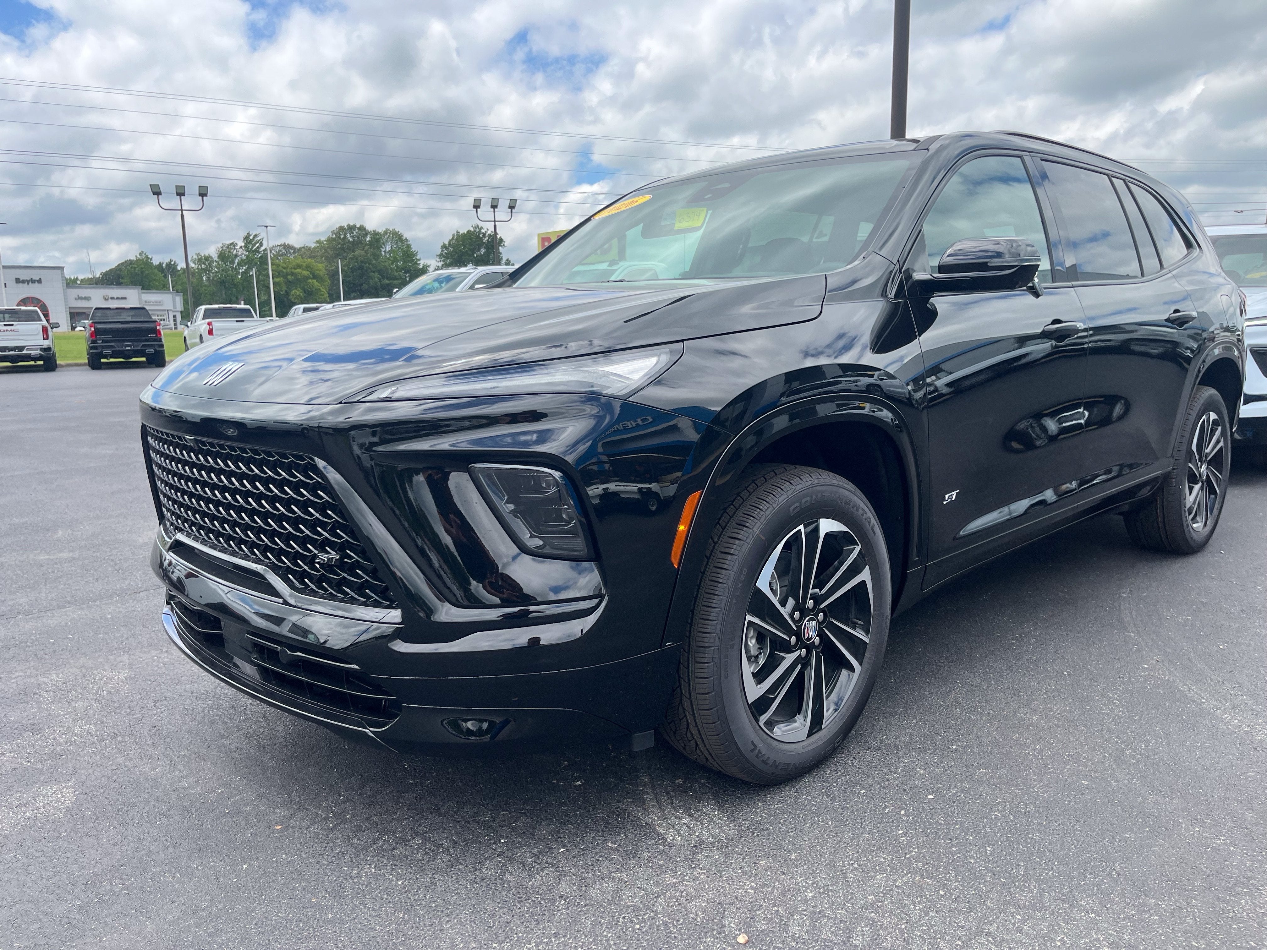 2026 Buick Enclave Sport Touring in Ebony Twilight Metallic — front three-quarter view