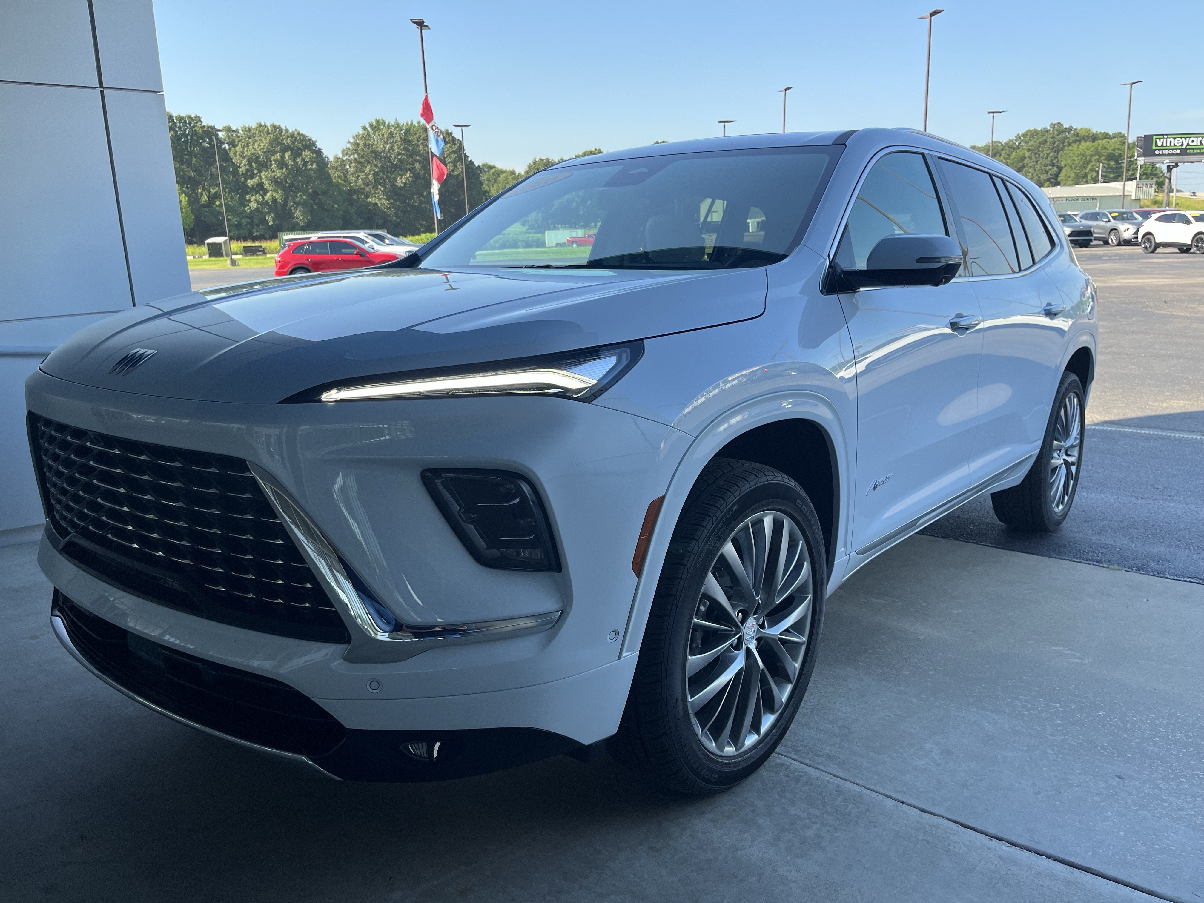 2026 Buick Enclave Avenir in Iridescent White Tricoat — front three-quarter view