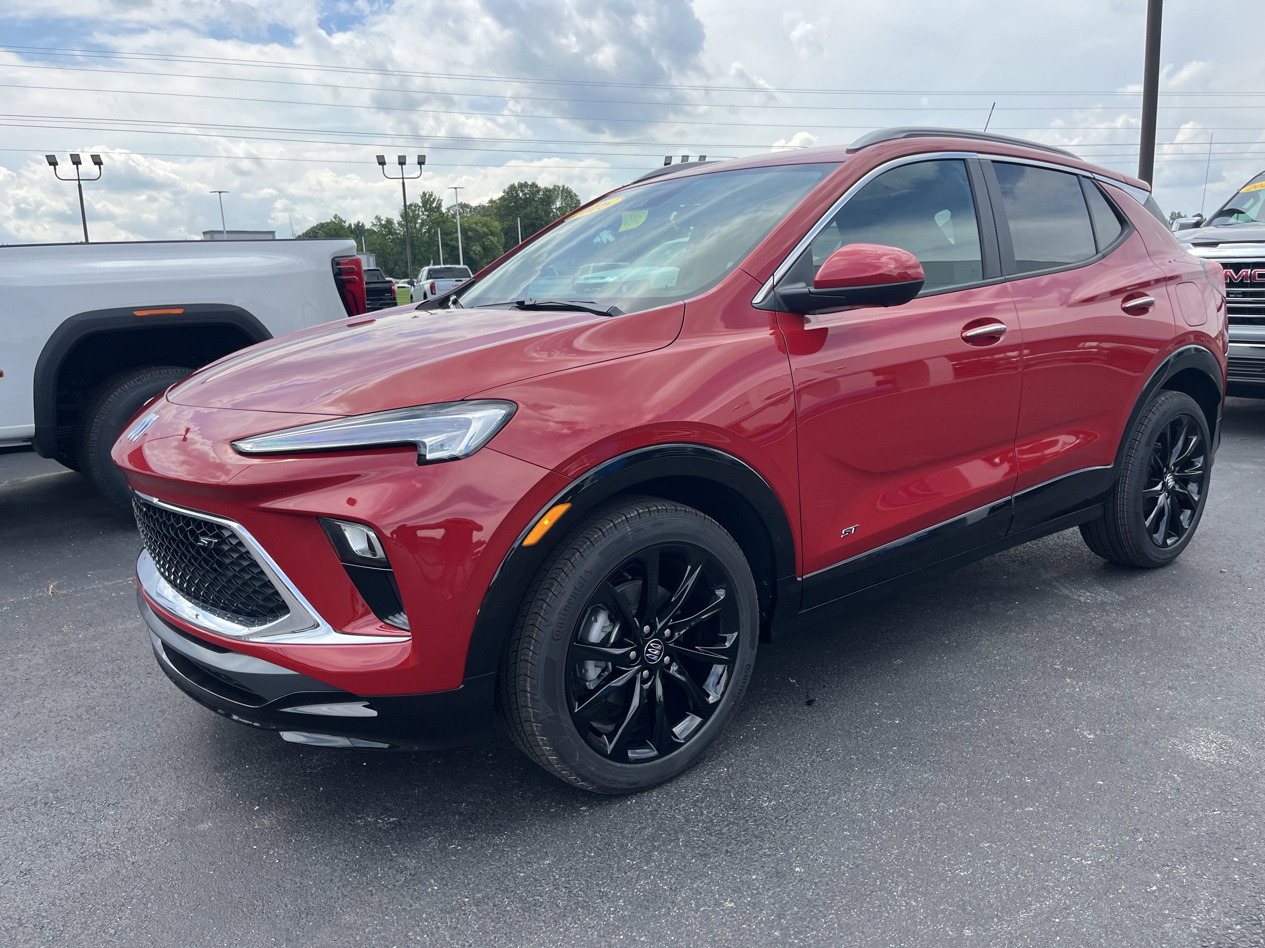 2026 Buick Encore GX Sport Touring in Brilliant Red — front three-quarter view