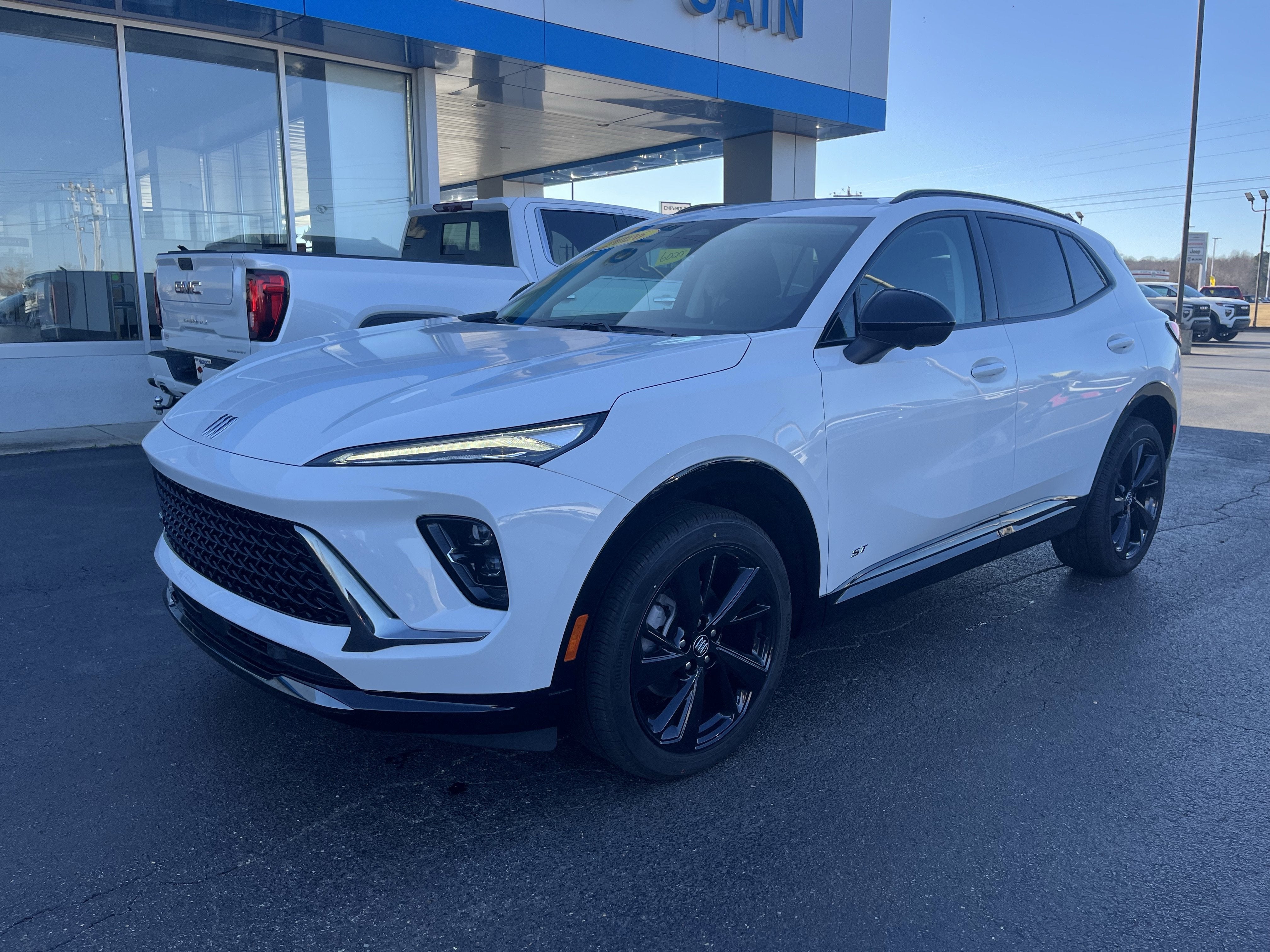 2026 Buick Envision Sport Touring in Summit White — front three-quarter view